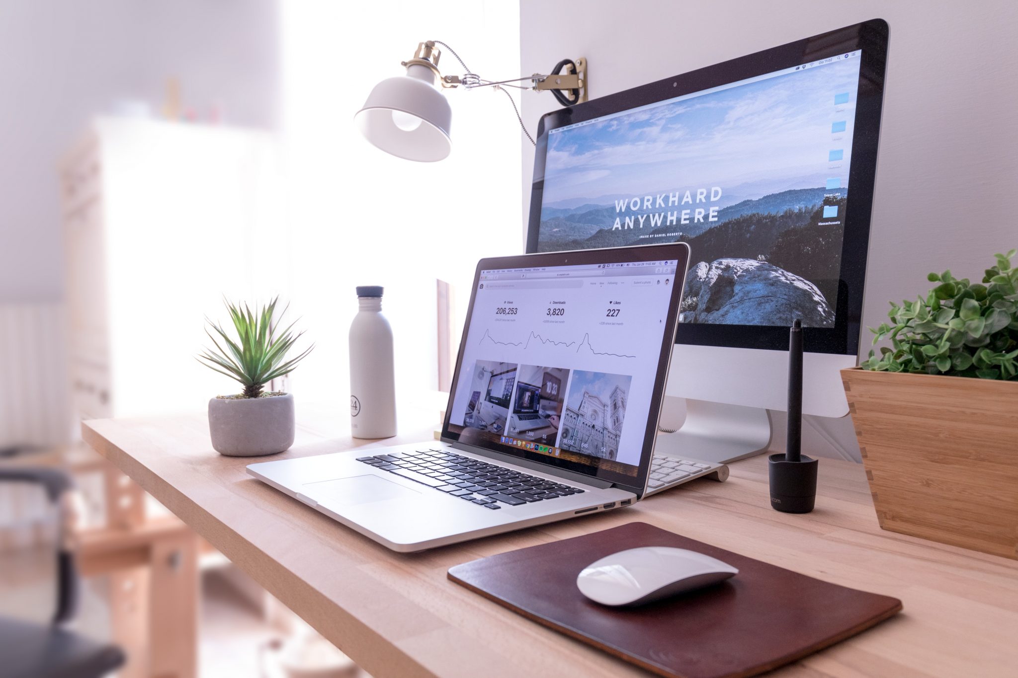 Desk with laptop and screen