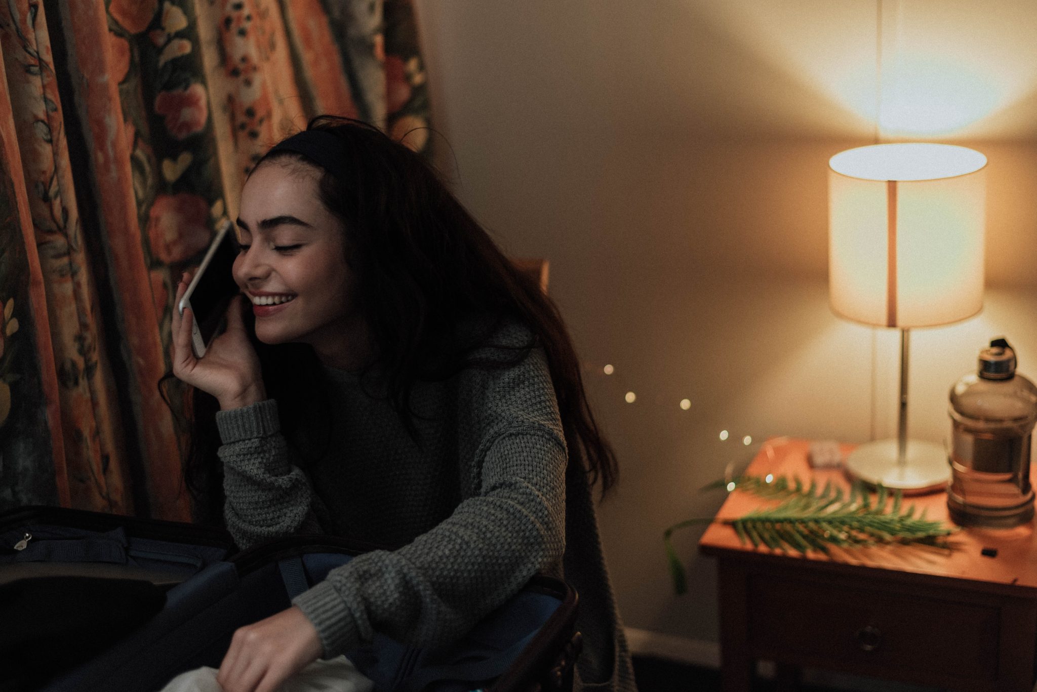 Girl speaking on the phone at home