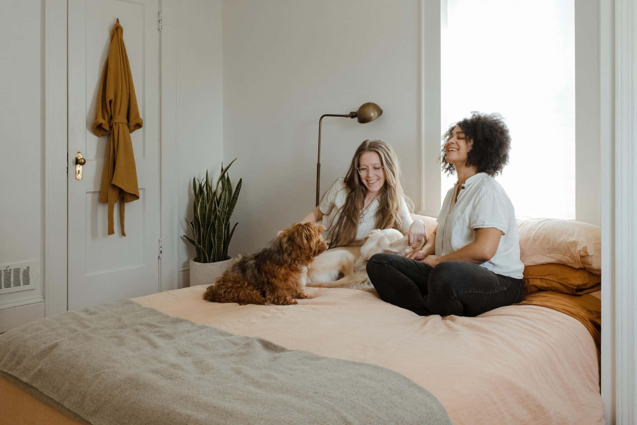 Girls-at-home-with-dog-laughing